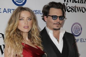 CULVER CITY, CA - JANUARY 09: Actors Amber Heard (L) and Johnny Depp attend The Art of Elysium 2016 HEAVEN Gala presented by Vivienne Westwood & Andreas Kronthaler at 3LABS on January 9, 2016 in Culver City, California.  (Photo by Alison Buck/Getty Images)